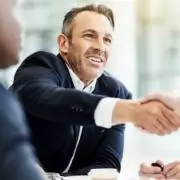 man shaking hands in a meeting