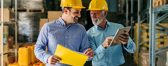 business-succession-planning Business Succession Planning- two smiling men in hard hats