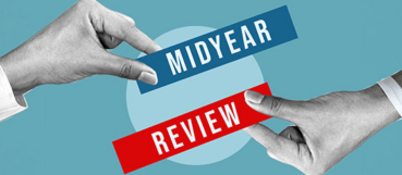 Hands exchanging "Midyear Review" cards, representing proactive tax planning in Harford County to identify tax-saving opportunities before year-end.